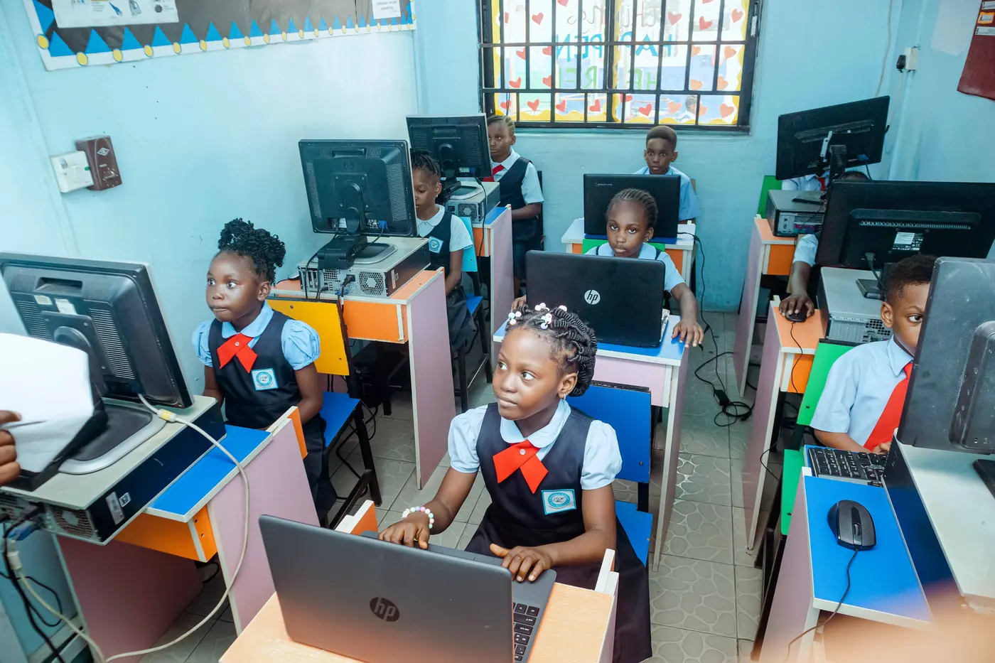 Primary pupils working on computers in the Chasteville ICT centre